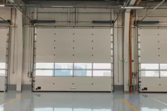 Garage rolling door in a new car workshop with resin floor.